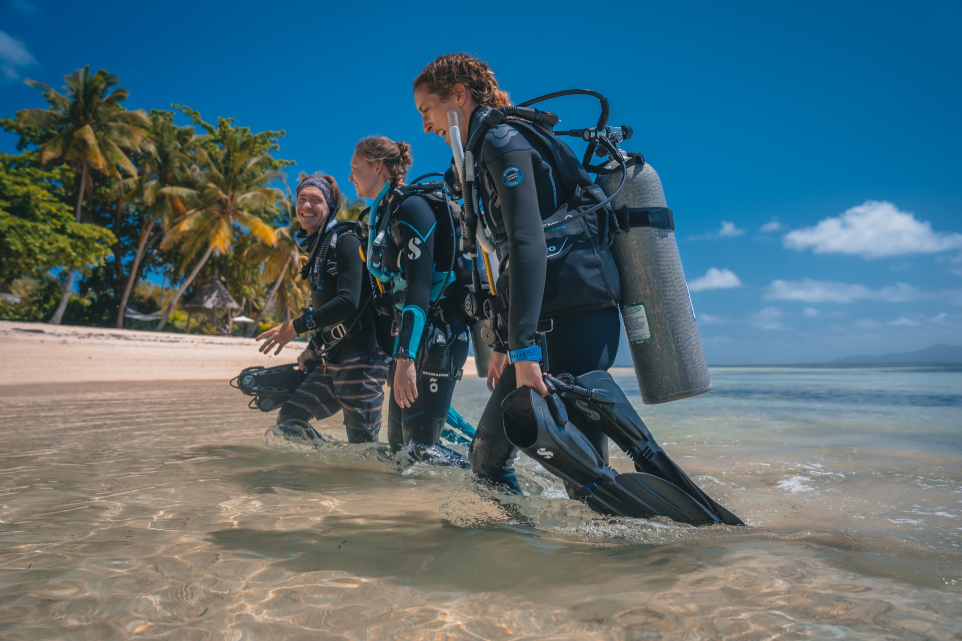 A happy group of divers together after a dive
